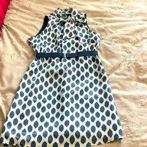 Ivory&Slate blue sleeveless dress ties into bow or knot at the neck. Side zipper